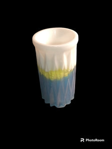 Blue and white vase with green accent