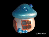 Blue mushroom house jar